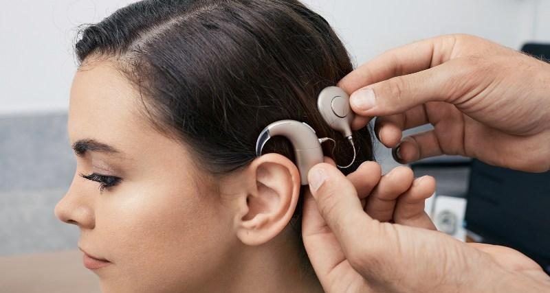 A patient receives a cochlear implant hearing aid system.